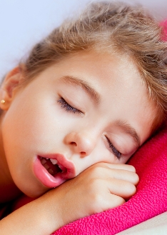 Deep sleeping children girl closeup portrait