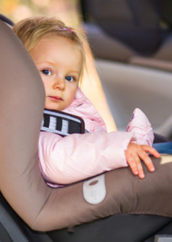 Infant baby girl in car seat